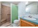 Main bathroom with a walk-in shower, toilet and vanity at 37700 Neukom Ave, Zephyrhills, FL 33541