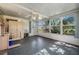 Screened sunroom offering additional living space with backyard access at 37700 Neukom Ave, Zephyrhills, FL 33541