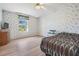 Bedroom with a bed, flooring, and patterned wallpaper at 37700 Neukom Ave, Zephyrhills, FL 33541