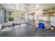 Bright sunroom with view into the backyard and access to the kitchen at 37700 Neukom Ave, Zephyrhills, FL 33541