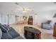 Living room with wood floors and view into the dining area at 37700 Neukom Ave, Zephyrhills, FL 33541