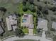 Aerial view of the property highlighting the private pool, screened lanai, and well-maintained yard at 13216 Legends Trl, Dade City, FL 33525