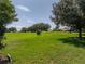 Open backyard offering lots of room for outdoor activities at 13216 Legends Trl, Dade City, FL 33525