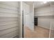 Walk-in closet with wire shelving and a closet safe at 13216 Legends Trl, Dade City, FL 33525