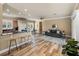 Spacious living room features wood floors, an open floor plan, and abundant natural light at 13216 Legends Trl, Dade City, FL 33525