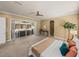 Large main bedroom offers patio access, neutral carpeting, and ample space for relaxation at 13216 Legends Trl, Dade City, FL 33525