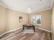 Office with wood-look floors, neutral walls, and a window with plantation shutters at 13216 Legends Trl, Dade City, FL 33525