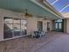 Large, covered patio featuring ceiling fans, perfect for outdoor dining and relaxation at 13216 Legends Trl, Dade City, FL 33525