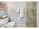 Bathroom with toilet, shower, and updated vanity at 329 Grayston Pl # 112, Sun City Center, FL 33573
