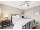 Well-lit bedroom with a comfortable bed and nightstand at 329 Grayston Pl # 112, Sun City Center, FL 33573