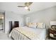 Spacious main bedroom with ample closet space and a ceiling fan at 329 Grayston Pl # 112, Sun City Center, FL 33573
