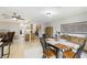 Open concept dining area with view into the kitchen at 329 Grayston Pl # 112, Sun City Center, FL 33573