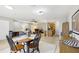 Open concept dining area with view into the kitchen at 329 Grayston Pl # 112, Sun City Center, FL 33573