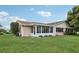 Back exterior view of the house with a screened porch at 329 Grayston Pl # 112, Sun City Center, FL 33573