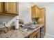 Clean kitchen with double sink and ample counter space at 329 Grayston Pl # 112, Sun City Center, FL 33573