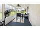Bright sunroom with table and chairs, perfect for relaxing at 329 Grayston Pl # 112, Sun City Center, FL 33573