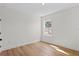 Well-lit bedroom featuring light walls and wood flooring at 3310 W Arch St, Tampa, FL 33607