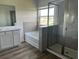 Well-appointed bathroom features a separate shower, soaking tub, and modern fixtures at 908 160Th E Ln, Bradenton, FL 34212