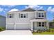Charming two-story home features a three-car garage, manicured landscaping, and inviting curb appeal at 908 160Th E Ln, Bradenton, FL 34212
