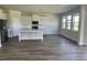 Open-concept kitchen boasts stainless steel appliances, white cabinetry, and a large center island at 908 160Th E Ln, Bradenton, FL 34212