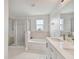 Bathroom with shower, bathtub and single vanity at 17350 Garden Heath Ct, Land O Lakes, FL 34638