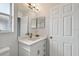 Small bathroom with single vanity and white cabinets at 17350 Garden Heath Ct, Land O Lakes, FL 34638