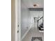 Bright entryway with gray walls, tile floors, and a staircase leading upstairs at 17350 Garden Heath Ct, Land O Lakes, FL 34638