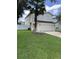 Two-story house with a two-car garage and a well-manicured lawn at 17350 Garden Heath Ct, Land O Lakes, FL 34638