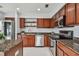 Modern kitchen with granite countertops and stainless steel appliances at 17350 Garden Heath Ct, Land O Lakes, FL 34638