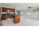 Open kitchen with an island, stainless steel appliances and wood cabinets at 17350 Garden Heath Ct, Land O Lakes, FL 34638