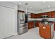 Open kitchen with stainless steel appliances and an island at 17350 Garden Heath Ct, Land O Lakes, FL 34638