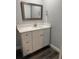 This bathroom features a white vanity with drawers, light countertops, and wood-look flooring at 1920 N Highland Ave, Clearwater, FL 33755