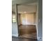 Clean bedroom featuring laminate floors, neutral walls, and closet at 1920 N Highland Ave, Clearwater, FL 33755