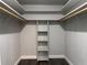 This large walk-in closet offers multiple rods and shelving for optimal storage and organization at 1920 N Highland Ave, Clearwater, FL 33755