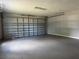 Spacious garage with a roll up door and room for storage and parking at 1920 N Highland Ave, Clearwater, FL 33755