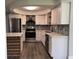 Stylish kitchen with white cabinets, modern appliances, stainless steel fridge, and decorative backsplash at 1920 N Highland Ave, Clearwater, FL 33755