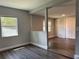 Light filled living room with modern laminate floors and neutral walls at 1920 N Highland Ave, Clearwater, FL 33755