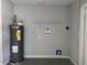 Utility room including water heater and hookups for washer and dryer at 1920 N Highland Ave, Clearwater, FL 33755