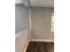 Interior wall featuring laminate floors and a window providing natural light at 1920 N Highland Ave, Clearwater, FL 33755