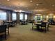 Elegant card room with tables and chairs for card games at 15953 Cobble Mill Dr, Wimauma, FL 33598