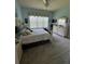 Spacious Primary bedroom with a king-size bed and plenty of natural light at 15953 Cobble Mill Dr, Wimauma, FL 33598