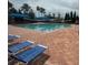 Inviting resort-style pool with blue lounge chairs at 15953 Cobble Mill Dr, Wimauma, FL 33598