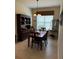 Cozy dining area with a farmhouse table and lovely hutch at 15953 Cobble Mill Dr, Wimauma, FL 33598