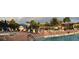 Resort-style pool with a hot tub and lounge chairs at 15953 Cobble Mill Dr, Wimauma, FL 33598