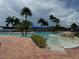 Large, resort-style pool with lush landscaping at 15953 Cobble Mill Dr, Wimauma, FL 33598