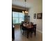 Bright dining room featuring a wooden table and hutch at 15953 Cobble Mill Dr, Wimauma, FL 33598