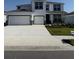 Inviting two-story home with a three-car garage and a well-manicured lawn at 18320 Fattoria Ter, Lakewood Ranch, FL 34211