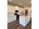 Modern kitchen features white cabinets, marble countertops, and stainless steel appliances at 18320 Fattoria Ter, Lakewood Ranch, FL 34211