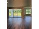 Spacious living room with sliding glass doors leading to the outdoor patio and backyard at 18320 Fattoria Ter, Lakewood Ranch, FL 34211