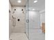 Bathroom featuring a walk-in shower, matte black fixtures, and light wood cabinets at 780 Eldorado Ave, Clearwater, FL 33767